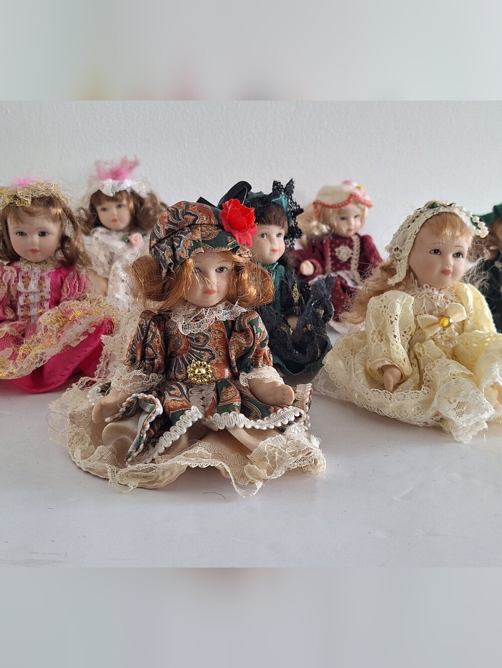 8 Small Porcelain Dolls